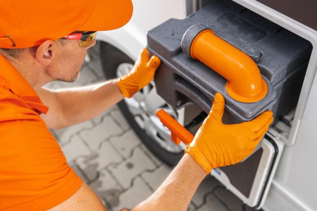 emptying a waste tank from a camper van