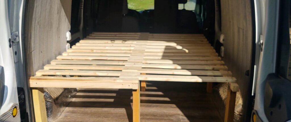 preventing condensation in a camper van by building a slat bed.