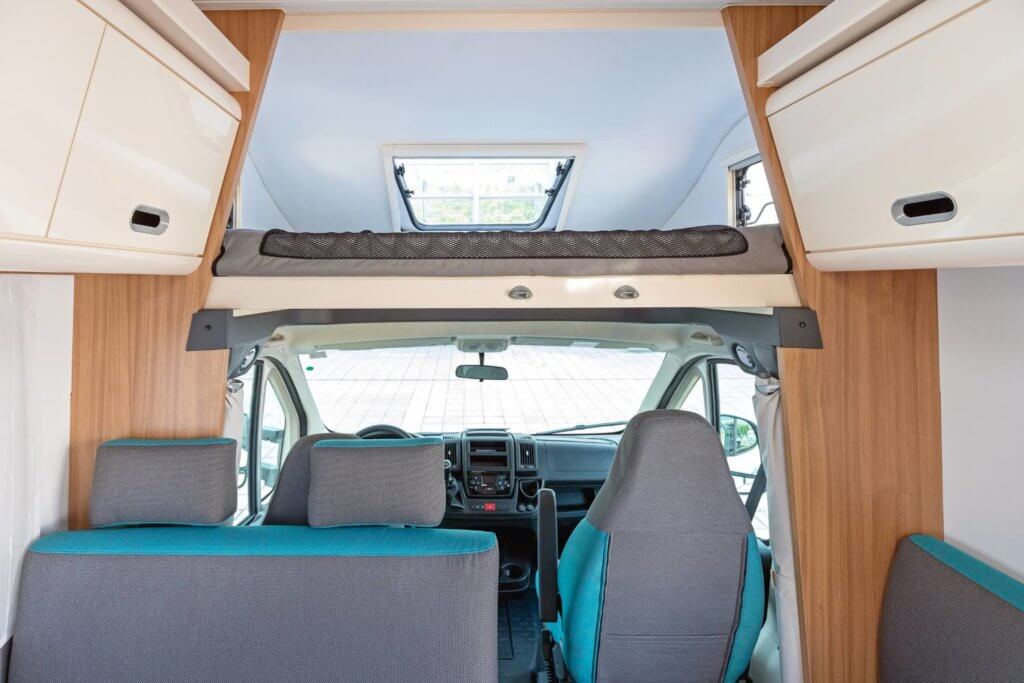 two back seats in a camper van with blue outlining