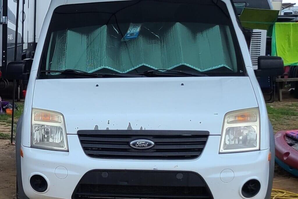 window unit hanging out of our drivers side camper van