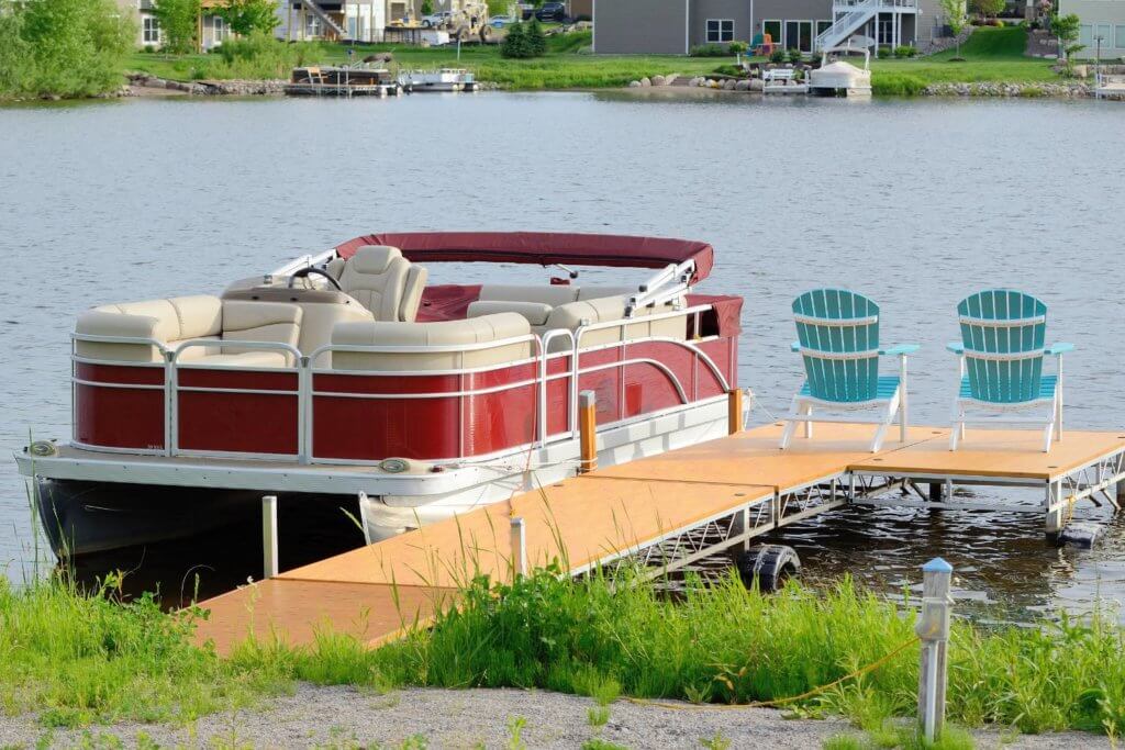 New red pontoon boat on Lake Lure