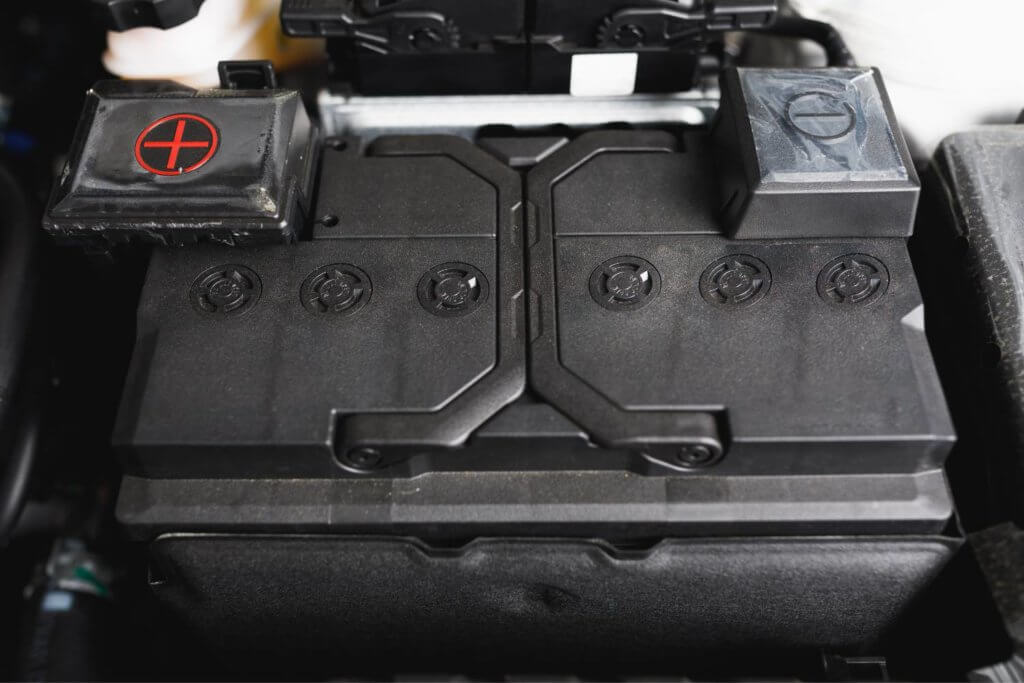 Vehicle battery under hood