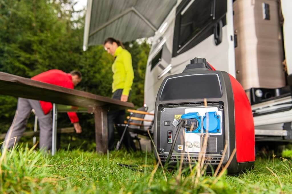 red camping generator next to camper van