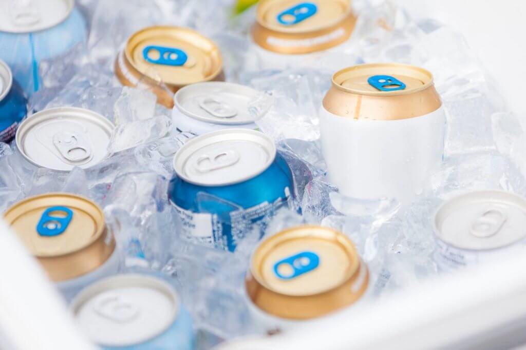 Ice in a cooler surrounding cans