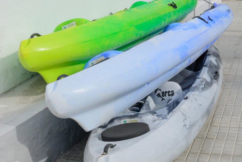 three kayaks stacked on top of eachother/ things to do on Edisto Island