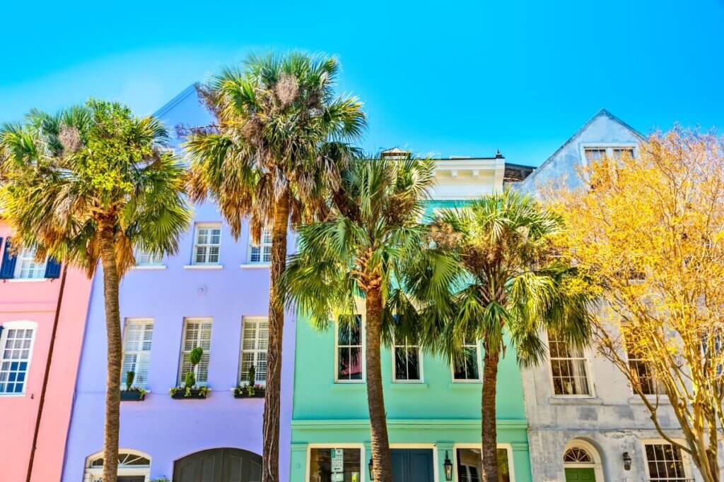 picture of purple, green, pink, and white houses in Charleston at Rainbow Row.