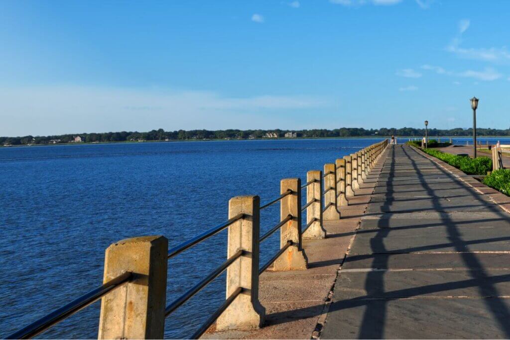 The battery hiking trail in Charleston South Carolina. Beautiful view of a paved dock overlooking an inlet.