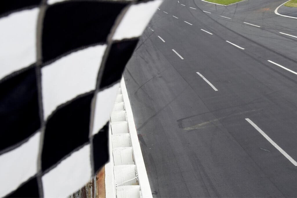 checkered flag over a speedway