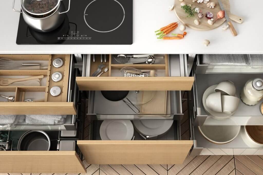 cabinets open in a camper van kitchen with organizers in them