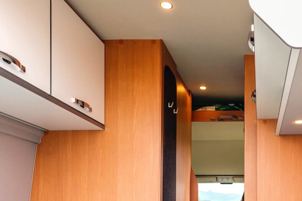 above cabinets in a camper van over bed