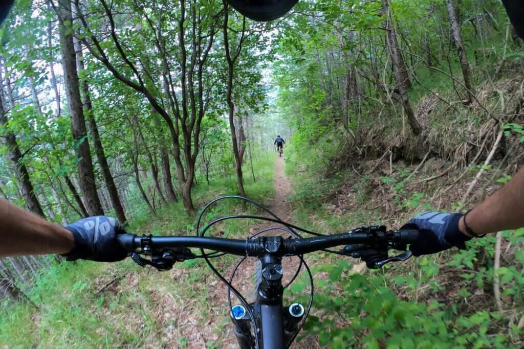 biking behind another biker in Uwharrie National Forest