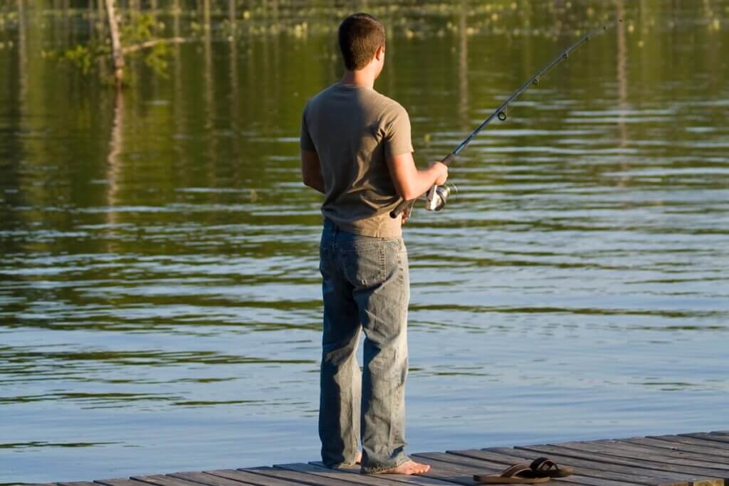 a person fishing off a dock in Uwharrie