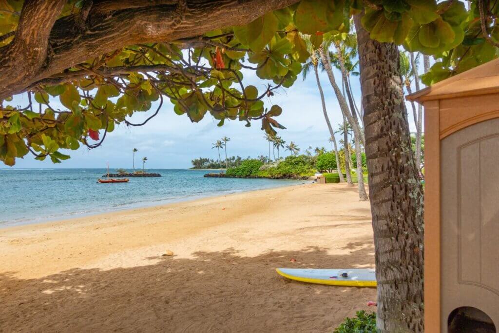 Kahala Beach with a surf board and a toilet on the beach