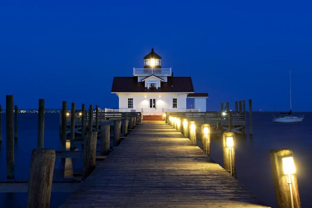 Roanoke Marshes Lighthouse during the night time with lights on