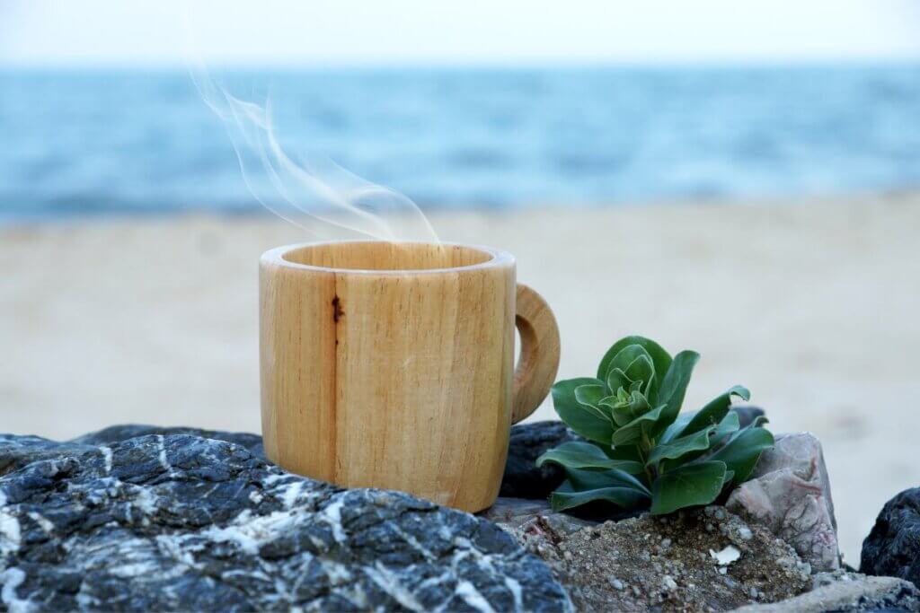 cup of coffee on a winter beach