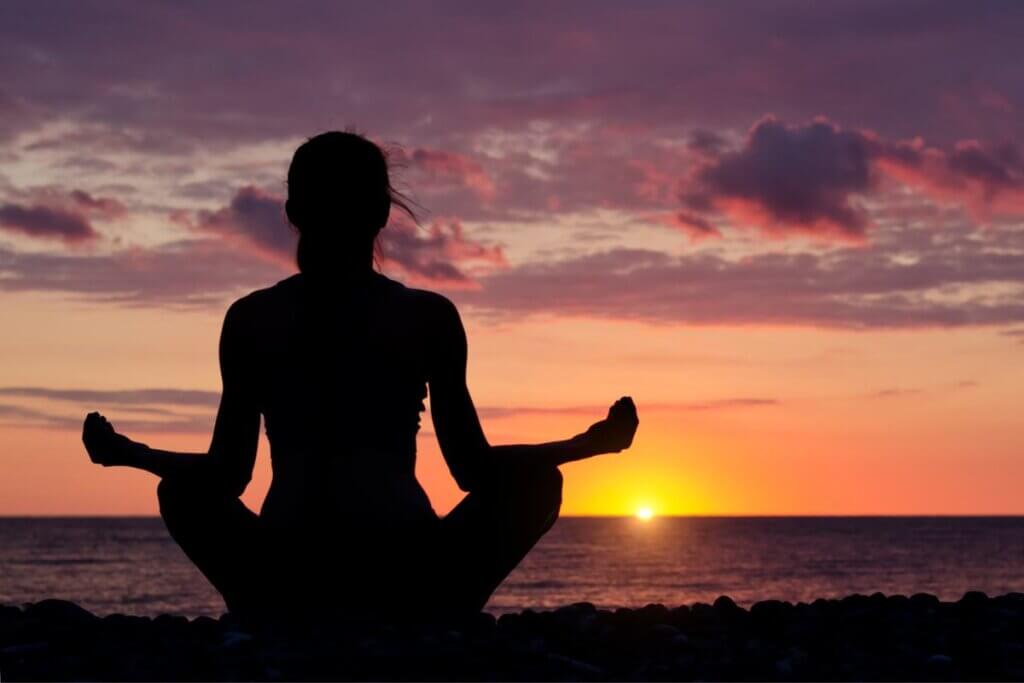 meditating as a winter activity on the beach